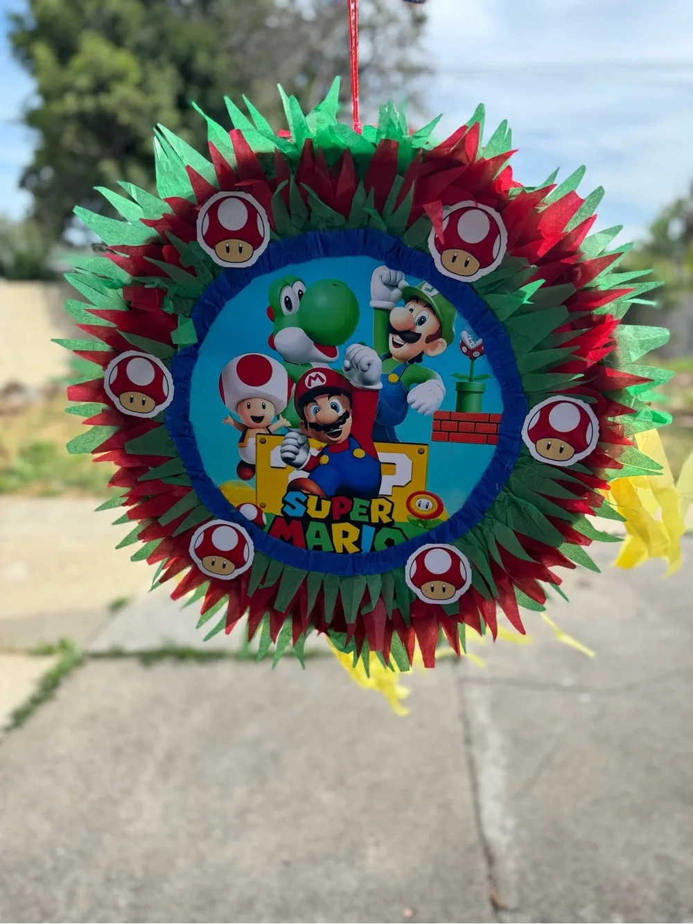 Super Mario Red & Green Party Piñata with Yellow Streamers